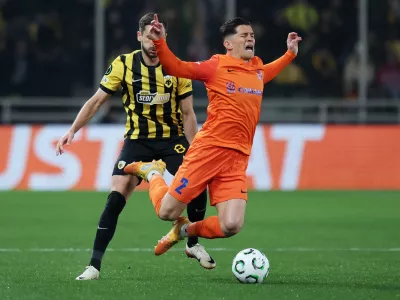 Soccer Football - UEFA Conference League - Round of 16 - Second Leg - AEK Athens v Celje - AEK Arena, Athens, Greece - March 19, 2026 NK Celje's Juanjo is fouled by AEK Athens' Mijat Gacinovic REUTERS/Alkis Konstantinidis