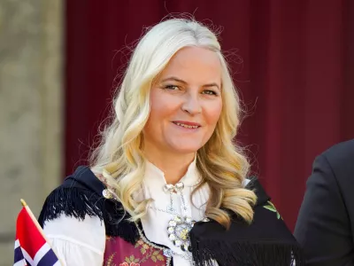 FILE - Norway's Crown Princess Mette-Marit watches a parade on the occasion of Norway's Constitution Day, at Skaugum, their official residence, near Oslo, Wednesday, May 17, 2023. (Lise Aserud/NTB Scanpix via AP, File)