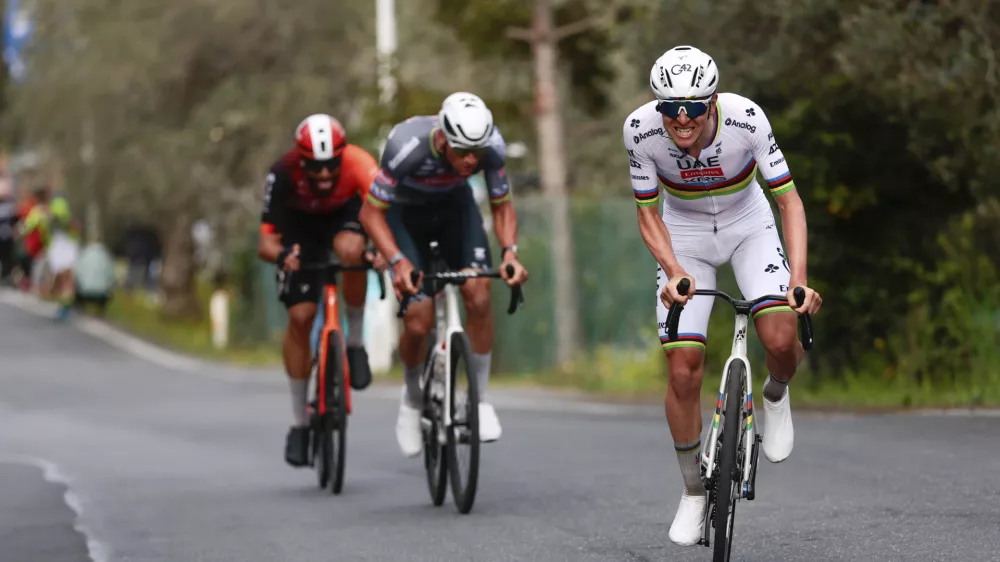 From left, second-placed Filippo Ganna, winner Mathieu van der Poel and third-placed Tadej Pogacar compete in the men's elite race of the Milano-Sanremo one day cycling race (289 km) from Pavia, in Sanremo, Italy, Saturday March 22, 2025. (Gian Mattia D'Alberto/LaPresse via AP)