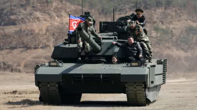 This photo provided by the North Korean government shows its leader Kim Jong Un, front right, his daughter, reportedly named Kim Ju Ae, and other soldiers on a tank at a military training base in North Korea, Thursday, March 19, 2026. Independent journalists were not given access to cover the event depicted in this image distributed by the North Korean government. The content of this image is as provided and cannot be independently verified. Korean language watermark on image as provided by source reads: "KCNA" which is the abbreviation for Korean Central News Agency. (Korean Central News Agency/Korea News Service via AP)