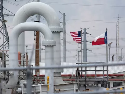FILE PHOTO: A maze of crude oil pipe and equipment is seen with the American and Texas flags flying in the background during a tour by the Department of Energy at the Strategic Petroleum Reserve in Freeport, Texas, U.S. June 9, 2016. REUTERS/Richard Carson/File Photo