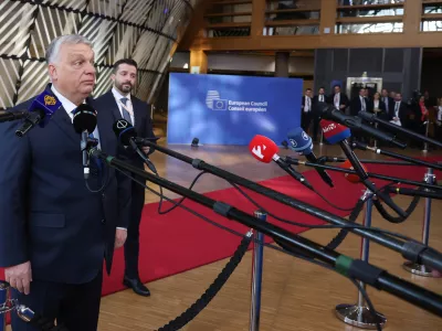 Hungary's Prime Minister Viktor Orban speaks with the media as he arrives for the EU summit at the European Council building in Brussels, Thursday, March 19, 2026. (AP Photo/Omar Havana)