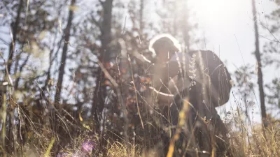 Mature Woman Hiking in Forest Alone.
