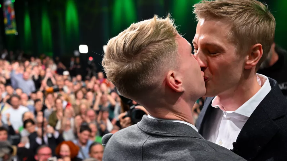 Dominik Krause, right, top candidate of the Green party, and his friend Sebastian M&uuml;ller, on stage at the Green Party election party after the run-off election for the office of Lord Mayor in the Bavarian capital of Munich, Germany, Sunday, March 22, 2026. (Sven Hoppe/dpa via AP)