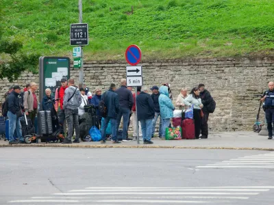 Narva, Estonia, 31 August 2025: On a Sunday afternoon in Peetri Square people queue at the pedestrian-only border point to cross from Estonia into Russia, and others travel in the opposite direction. Although the Estonian government advises against travel to Russia, many people in this 95% Russian-speaking enclave have connections over the border. Strict customs searches operate, often leading to long queues. No gold jewellery or European currencies can be taken into Russia, although American dollars and British pounds can be. Russians are not allowed to enter Estonia except to visit immediate family.,Image: 1033025490, License: Rights-managed, Restrictions: Usage restrictions: Advertising and promotion,Commercial electronic,Consumer goods,Direct mail and brochures,Indoor display,Internal business usage,Personal use, Model Release: no