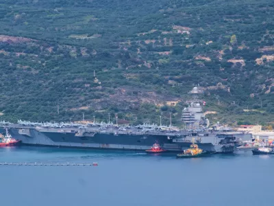 The USS Gerald R. Ford aircraft carrier is docked at Souda Naval Base near Chania on the island of Crete, Monday, March 23, 2026. (AP Photo/Giannis Angelakis)