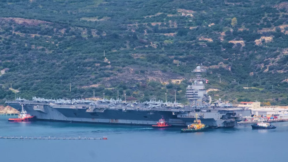 The USS Gerald R. Ford aircraft carrier is docked at Souda Naval Base near Chania on the island of Crete, Monday, March 23, 2026. (AP Photo/Giannis Angelakis)