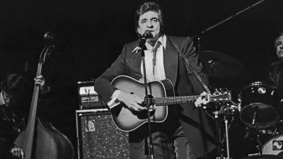American country singer and song writer Johnny Cash performing at Hamburg, Germany, circa 1981. (Photo by Helmut Reiss/United Archives via Getty Images)