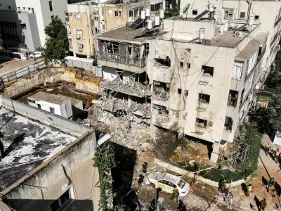 A drone view of emergency personnel working at a site following Iranian missile barrages in central Israel, amid the U.S.-Israel conflict with Iran, in Tel Aviv, Israel, March 24, 2026. REUTERS/Roei Kastro