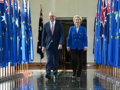 Australian Prime Minister Anthony Albanese and President of the European Commission Ursula von der Leyen walk together after an address to Members and Senators during a joint sitting in the House of Representatives at Parliament House in Canberra, Australia, March 24, 2026. Lukas Coch/AAP/via REUTERS  ATTENTION EDITORS - THIS IMAGE WAS PROVIDED BY A THIRD PARTY. NO RESALES. NO ARCHIVE. AUSTRALIA OUT. NEW ZEALAND OUT. NO COMMERCIAL OR EDITORIAL SALES IN NEW ZEALAND. NO COMMERCIAL OR EDITORIAL SALES IN AUSTRALIA.