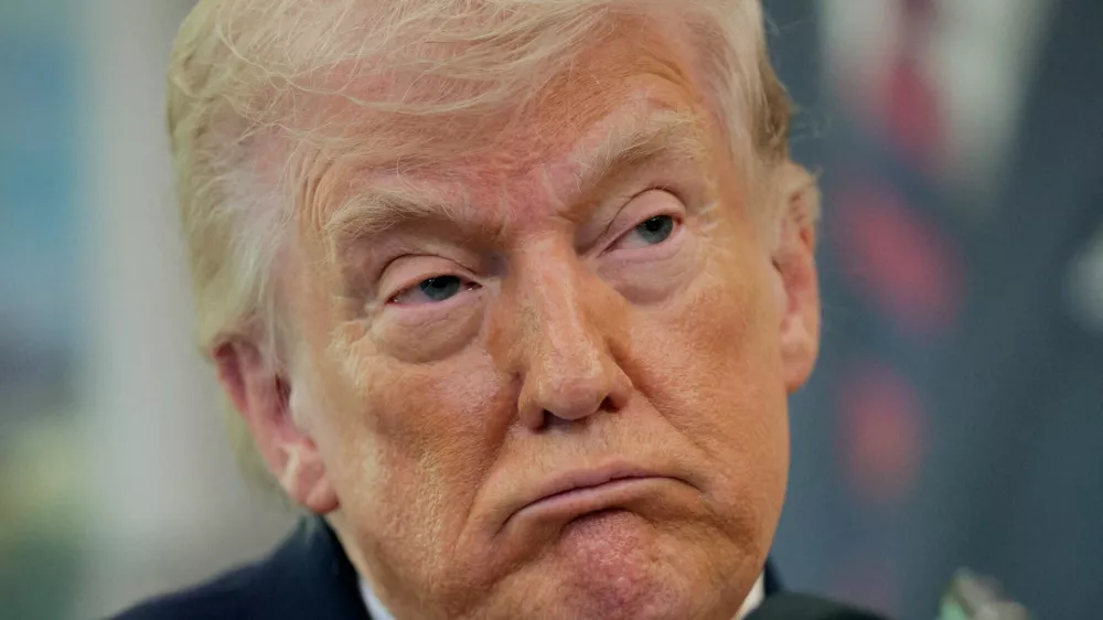 U.S. President Donald Trump looks on as he attends Markwayne Mullin's swearing-in as Department of Homeland Security (DHS) Secretary, at the White House in Washington, D.C., U.S., March 24, 2026. REUTERS/Evan Vucci