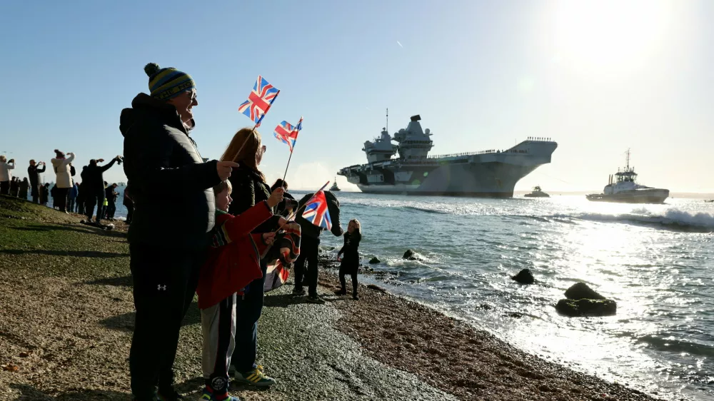 People gather to watch HMS Prince of Wales return home to Portsmouth, following an eight-month Indo-Pacific deployment as part of Operation Highmast, in Portsmouth, Britain November 30, 2025. UK MOD Crown/Ollie Leach/Handout via REUTERS THIS IMAGE HAS BEEN SUPPLIED BY A THIRD PARTY