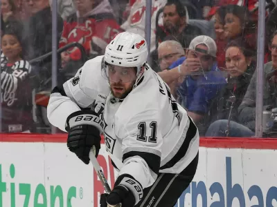 Mar 14, 2026; Newark, New Jersey, USA; Los Angeles Kings center Anze Kopitar (11) passes the puck against the New Jersey Devils during the first period at Prudential Center. Mandatory Credit: Ed Mulholland-Imagn Images