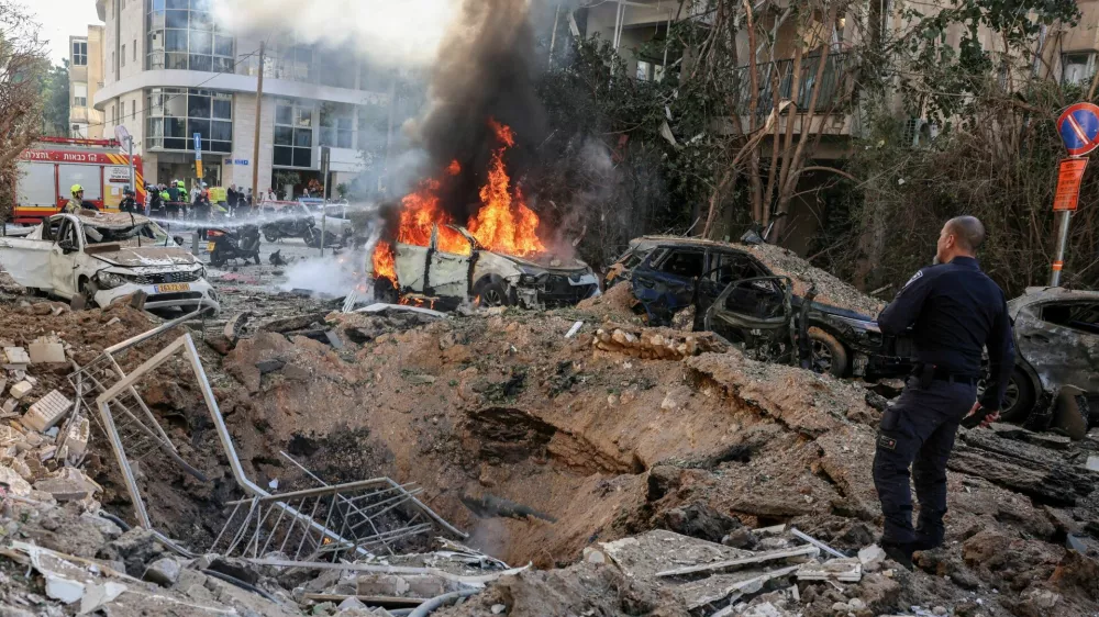 FILE PHOTO: Emergency personnel respond at a site following Iranian missile barrages in central Israel, amid the U.S.-Israel conflict with Iran, in Tel Aviv, Israel, March 24, 2026. REUTERS/Tomer Appelbaum ISRAEL OUT. NO COMMERCIAL OR EDITORIAL SALES IN ISRAEL/File Photo