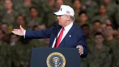 U.S. President Donald Trump speaks to the soldiers and servicemen during his visit to the USS George Washington at the U.S. Navy's Yokosuka base in Yokosuka, south of Tokyo, Tuesday, Oct. 28, 2025. (AP Photo/Eugene Hoshiko)
