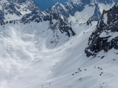 A beautiful view from the Zugspitze summit on the Alps on at spring. Bavarian Alps, Germany. Zugspitze Ski Resort. Spring in the Bavarian Alps.,Image: 993059564, License: Royalty-free, Restrictions:, Model Release: yes