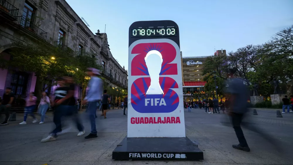 People walk past a countdown clock for the FIFA World Cup 2026 as the city prepares for the tournament, jointly hosted by the United States, Canada and Mexico, in Guadalajara, Mexico, March 24, 2026. REUTERS/Eloisa Sanchez