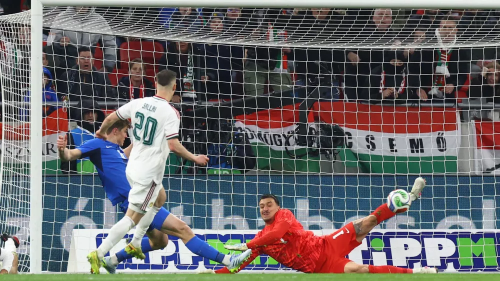 Soccer Football - International Friendly - Hungary v Slovenia - Puskas Arena, Budapest, Hungary - March 28, 2026 Slovenia's Igor Vekic in action as he makes a save from Hungary's Roland Sallai REUTERS/Bernadett Szabo