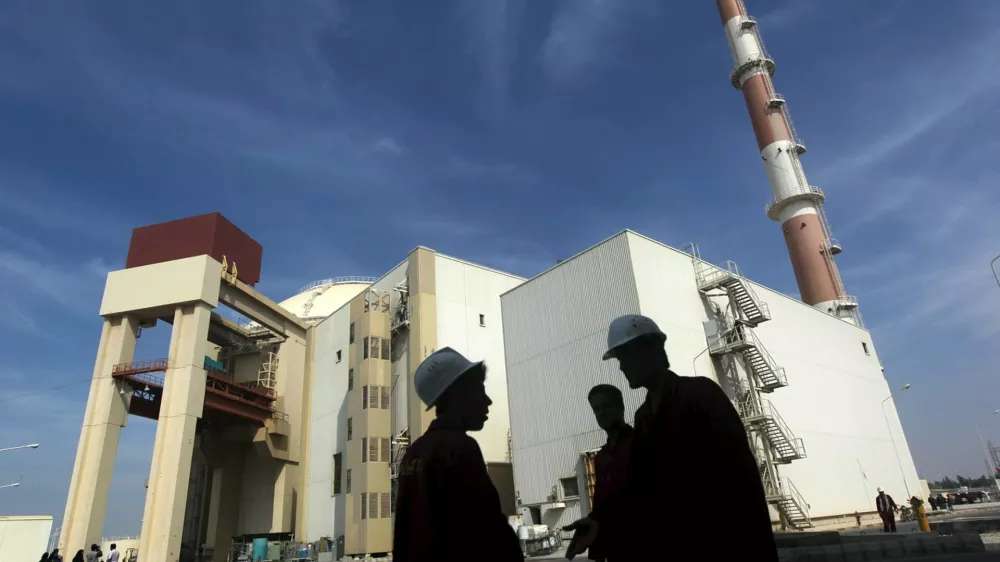 Iranian workers stand in front of the Bushehr nuclear power plant, about 1,200 km (746 miles) south of Tehran in this October 26, 2010 file photo. Iran and six major world powers have reached a nuclear deal after more than a decade of on-off negotiation, granting Tehran sanctions relief in exchange for curbs on its nuclear program, Iranian diplomats said on Tuesday. REUTERS/Mehr News Agency/Majid Asgaripour/FilesFROM THE FILES PACKAGE - IRAN DEAL - SEARCH "IRAN FILES" TO FIND ALL 27 IMAGES