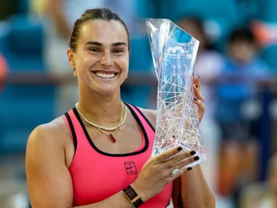 Mar 28, 2026; Miami Gardens, FL, USA; Aryna Sabalenka of Belarus poses with the Butch Buchholz Championship trophy after defeating Coco Gauff of the United States in the final of the women's singles at the Hard Rock Stadium. Mandatory Credit: Mike Frey-Imagn Images   TPX IMAGES OF THE DAY