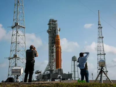 People photograph NASA's next-generation moon rocket, the Space Launch System (SLS) rocket with the Orion crew capsule, on Pad 39B ahead of the Artemis II mission launch at the Kennedy Space Center in Cape Canaveral, Florida, U.S., March 29, 2026. REUTERS/Brendan McDermid
