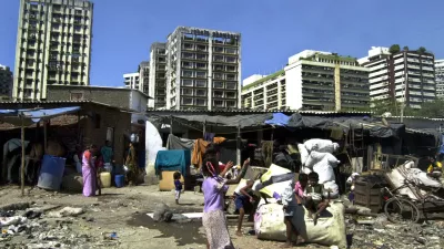 Children play in a slum in Bombay, India, Wednesday, Feb. 2, 2005. 80,000 shanties have been demolished since Dec. 7 across India's financial capital, part of an ambitious 370 billion rupee (US.2 billion; euro6.3 billion) urban renewal plan for broader roads, new rail lines and bigger bridges. Officials say the shanties blocked the new projects, but activists say some 350,000 slum dwellers are now homeless. 54 percent of Bombay's estimated 15 million people live in slums along railway tracks, on sidewalks, in parks or encroachments on government land. (AP Photo/Rajesh Nirgude)