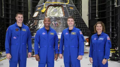 FILE - Artemis II crew members, from left, Jeremy Hansen, Victor Glover, Reid Wiseman and Christina Koch, stand together at NASA's Kennedy Space Center in Florida, in front of an Orion crew module on Tuesday, Aug. 8, 2023. On Tuesday, Jan. 9, 2024, NASA said astronauts will have to wait until 2025 before flying to the moon and another few years before landing on it. (Kim Shiflett/NASA via AP, File)