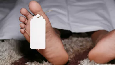 The dead man's body with tag on feet under white cloth in a morgue.,Image: 668558601, License: Royalty-free, Restrictions:, Model Release: no