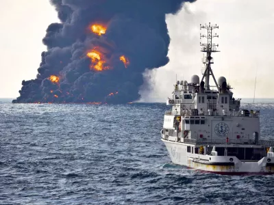 In this Sunday, Jan. 14, 2018, photo provided by China's Ministry of Transport, a rescue ship sails near the burning Iranian oil tanker Sanchi in the East China Sea off the eastern coast of China. The fire from the sunken Iranian tanker ship in the East China Sea has burned out, a Chinese transport ministry spokesman said Monday, although concerns remain about possible major pollution to the sea bed and surrounding waters. (Ministry of Transport via AP)