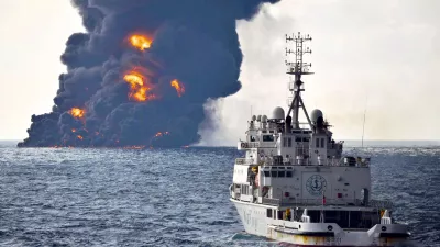 In this Sunday, Jan. 14, 2018, photo provided by China's Ministry of Transport, a rescue ship sails near the burning Iranian oil tanker Sanchi in the East China Sea off the eastern coast of China. The fire from the sunken Iranian tanker ship in the East China Sea has burned out, a Chinese transport ministry spokesman said Monday, although concerns remain about possible major pollution to the sea bed and surrounding waters. (Ministry of Transport via AP)