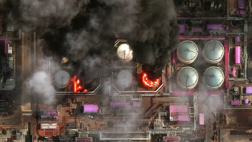 A satellite near-infrared image shows smoke rising from oil storage tanks at Russia's Baltic Sea port of Ust-Luga, which was struck multiple times in Ukrainian attacks, in Ust-Luga, Russia March 29, 2026. Vantor/Handout via REUTERS  THIS IMAGE HAS BEEN SUPPLIED BY A THIRD PARTY. NO RESALES. NO ARCHIVES. MANDATORY CREDIT. DO NOT OBSCURE LOGO.