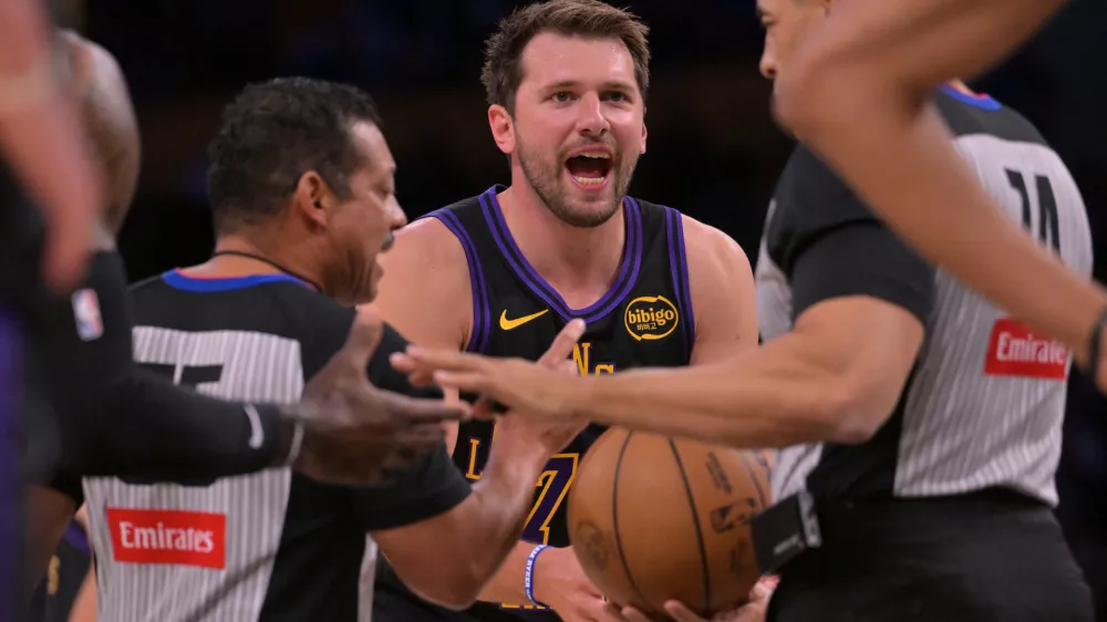 Mar 31, 2026; Los Angeles, California, USA; Los Angeles Lakers guard Luka Doncic (77) argues a foul call in the first half against the Cleveland Cavaliers at Crypto.com Arena. Mandatory Credit: Jayne Kamin-Oncea-Imagn Images