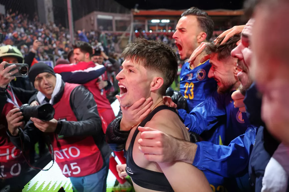 Bosnia's Esmir Bajraktarevic celebrates after winning a penalty shootout during the World Cup qualifying playoff final soccer match between Bosnia and Italy in Zenica, Bosnia, Tuesday, March 31, 2026. (AP Photo/Armin Durgut)