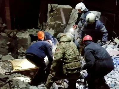 Emergency responders retrieve bodies from the rubble of a devastated building following a Ukrainian attack in a location given as Lysychansk, in the occupied eastern Ukrainian region of Luhansk, in this screen grab obtained from a video released February 3, 2024. Russian Emergencies Ministry/Handout via REUTERS THIS IMAGE HAS BEEN SUPPLIED BY A THIRD PARTY. MANDATORY CREDIT. NO RESALES. NO ARCHIVES.