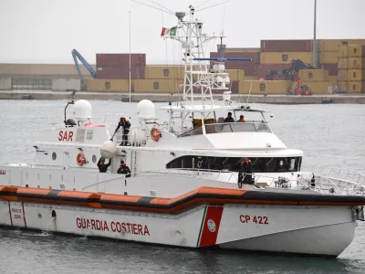 FILE - An Italian Coast Guard ship taking back the first 12 migrants from a newly opened asylum processing center in Shengjin, Albania, arrives in the harbor of Bari, in southern Italy, on Saturday, Oct. 19, 2024. (AP Photo/Valeria Ferraro, file)
