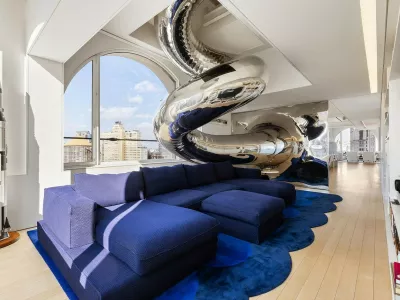 EXCLUSIVE: Story from Jam Press (Insane Sky House)'Sky house' with multi-floor SLIDE and indoor climbing wall goes on sale for 0mA one-of-a-kind "sky house" perched on top of a 23-storey skyscraper has hit the market for a staggering 0m.The jaw-dropping home crowns a historic building at 150 Nassau Street in New York and spans the top four floors.Inside, the 6,500 sq ft property is packed with quirky features, including a giant spiral slide running through the home.The stainless steel slide starts at the very top and winds its way down two floors before ending in the main living space.There is even an indoor climbing wall and rope swing at the heart of the property, as reported by creatorzine.com.The open-plan living area boasts soaring ceilings of up to 46ft and massive arched windows with sweeping views across the New York skyline and rivers.A large terrace also offers stunning panoramic views across the city.Elsewhere, the luxury home features multiple bedrooms, a high-end kitchen fitted with top-of-the-range appliances and a separate prep kitchen.There are also wine fridges, a laundry room and several bathrooms, including a spa-style main bathroom complete with a steam shower and heated floors.The upper level, currently used as a gym, includes the top of the climbing wall and access to the slide.The building itself dates back to 1895 and is considered one of New York's earliest steel-frame skyscrapers.Known as the "Sky House", the property was designed by architect David Hotson and interior designer Ghislaine Vińas.It has previously won major design awards and has been described as a unique architectural masterpiece.The incredible home is now up for sale with a price tag of 0m.ENDS.26 Mar 2026Pictured: Story from Jam Press (Insane Sky House)Pictured: The one-of-a-kind "sky house".'Sky house' with multi-floor SLIDE and indoor climbing wall goes on sale for 0mA one-of-a-kind "sky house" perched on top of a 23-storey skyscraper has hit the market for a staggering 0m.The jaw-dropping home crowns a historic building at 150 Nassau Street in New York and spans the top four floors.Inside, the 6,500 sq ft property is packed with quirky features, including a giant spiral slide running through the home.The stainless steel slide starts at the very top and winds its way down two floors before ending in the main living space.There is even an indoor climbing wall and rope swing at the heart of the property, as reported by creatorzine.com.The open-plan living area boasts soaring ceilings of up to 46ft and massive arched windows with sweeping views across the New York skyline and rivers.A large terrace also offers stunning panoramic views across the city.Elsewhere, the luxury home.,Image: 1086414306, License: Rights-managed, Restrictions: NO Australia, Germany, Norway, South Korea, Sweden, United Kingdom, United States, Unknown Country, Model Release: no, Pictured: Floorplan