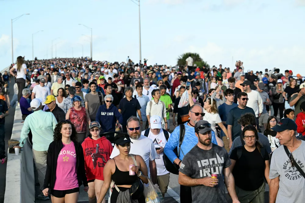 Spectators leave the A. Max Brewer Bridge after viewing NASA's Artemis II moon rocket launch, Wednesday, April 1, 2026, in Titusville, Fla. (AP Photo/Phelan M. Ebenhack)