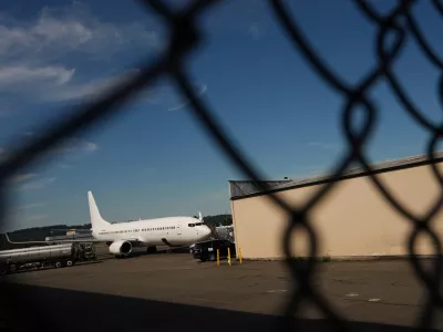 FILE - A U.S. Immigration and Customs Enforcement flight operates out of King County International Airport-Boeing Field, Aug. 23, 2025, in Seattle. (AP Photo/Lindsey Wasson, File)