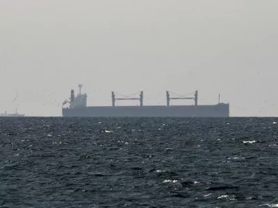 FILE PHOTO: FILE PHOTO: A cargo ship in the Gulf, near the Strait of Hormuz, as seen from northern Ras al-Khaimah, near the border with Oman's Musandam governance, amid the U.S.-Israeli conflict with Iran, in United Arab Emirates, March 11, 2026. REUTERS/Stringer/File Photo/File Photo
