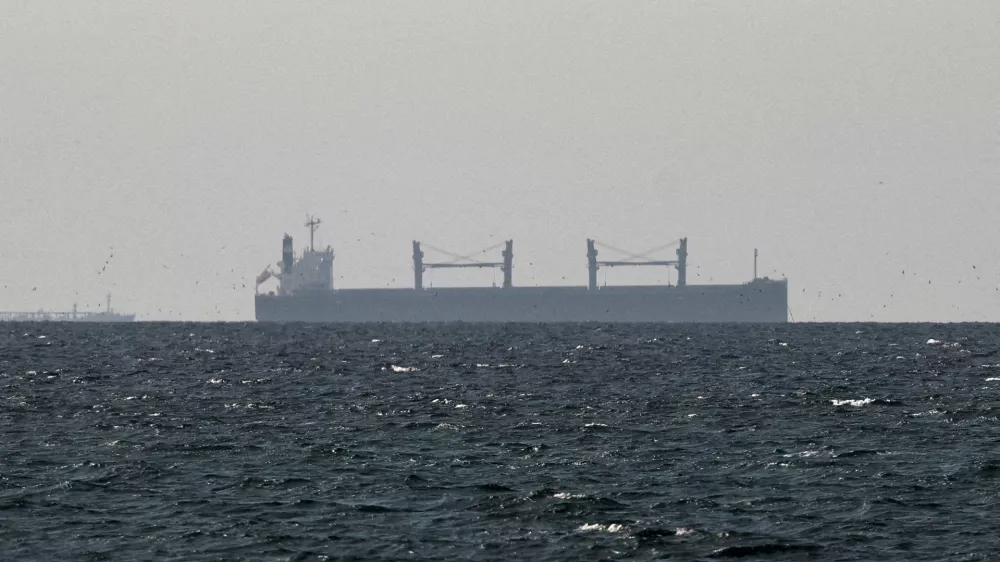 FILE PHOTO: FILE PHOTO: A cargo ship in the Gulf, near the Strait of Hormuz, as seen from northern Ras al-Khaimah, near the border with Oman's Musandam governance, amid the U.S.-Israeli conflict with Iran, in United Arab Emirates, March 11, 2026. REUTERS/Stringer/File Photo/File Photo