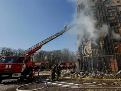 Firefighters work at the scene of an apartment building hit by a Russian drone strike, amid Russia's attack on Ukraine, in Kharkiv, Ukraine, April 2, 2026. REUTERS/Sofiia Gatilova