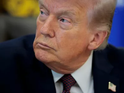 FILE PHOTO: U.S. President Donald Trump attends the signing ceremony for an execituve order on mail ballots, in the Oval Office of the White House in Washington, D.C., March 31, 2026. REUTERS/Evan Vucci/File Photo