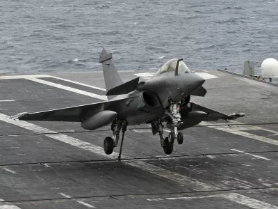 A Rafale fighter jet makes a cable arrest landing on the flight deck of French aircraft carrier "Charles De Gaulle" during sea trials in the Mediterranean sea in this November 26, 2009 file picture. France could start military operations against Libya in a matter of hours following the U.N. Security Council resolution authorising such action, government spokesman Francois Baroin said on March 18, 2011.  REUTERS/Jean-Paul Pelissier/Files (FRANCE - Tags: TRANSPORT MILITARY POLITICS)
