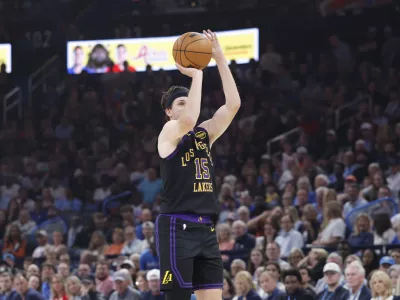 Apr 2, 2026; Oklahoma City, Oklahoma, USA; Los Angeles Lakers guard Austin Reaves (15) shoots a three point basket against the Oklahoma City Thunder during the first quarter at Paycom Center. Mandatory Credit: Alonzo Adams-Imagn Images