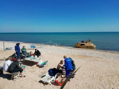 Rescued members of a dry cargo ship, which sank in the Sea of ​​Azov, according to local authorities, are assisted on the coast of the Russian-controlled part of the Kherson region, Ukraine, in this picture released on April 5, 2026. Vladimir Saldo, leader of the Russian-controlled parts of Kherson region via Telegram/Handout via REUTERS ATTENTION EDITORS - THIS IMAGE WAS PROVIDED BY A THIRD PARTY. NO RESALES. NO ARCHIVES. MANDATORY CREDIT