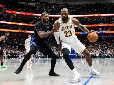 Apr 5, 2026; Dallas, Texas, USA; Los Angeles Lakers forward LeBron James (23) controls the ball as Dallas Mavericks forward Naji Marshall (13) defends during the second half at American Airlines Center. Mandatory Credit: Kevin Jairaj-Imagn Images