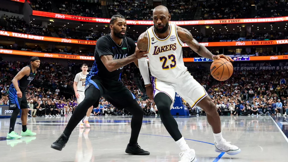 Apr 5, 2026; Dallas, Texas, USA; Los Angeles Lakers forward LeBron James (23) controls the ball as Dallas Mavericks forward Naji Marshall (13) defends during the second half at American Airlines Center. Mandatory Credit: Kevin Jairaj-Imagn Images