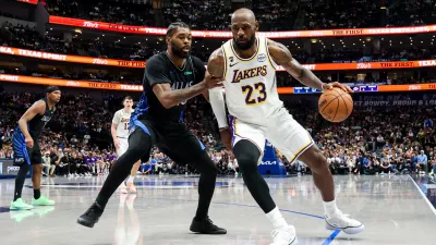 Apr 5, 2026; Dallas, Texas, USA; Los Angeles Lakers forward LeBron James (23) controls the ball as Dallas Mavericks forward Naji Marshall (13) defends during the second half at American Airlines Center. Mandatory Credit: Kevin Jairaj-Imagn Images