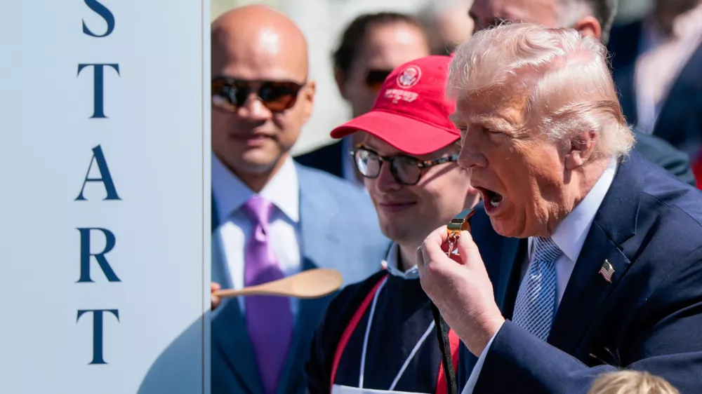 U.S. President Donald Trump blows a whistle during the 2026 White House Easter Egg Roll at the White House in Washington, D.C., U.S., April 6, 2026. REUTERS/Evan Vucci