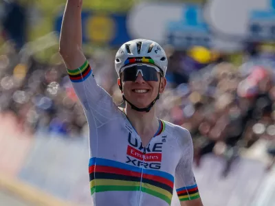 Slovenia's Tadej Pogacar crosses the finish line to win the Tour of Flanders cycling race, in Oudenaarde, Belgium Sunday, April 5, 2026. (AP Photo/Geert Vanden Wijngaert)